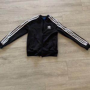 This is a black and white Adidas jacket it’s barely been worn